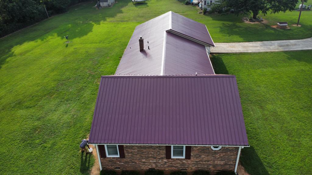 A top view of a house with a purple metal roof